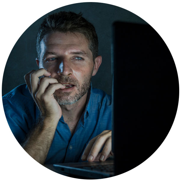 Man watching computer monitor